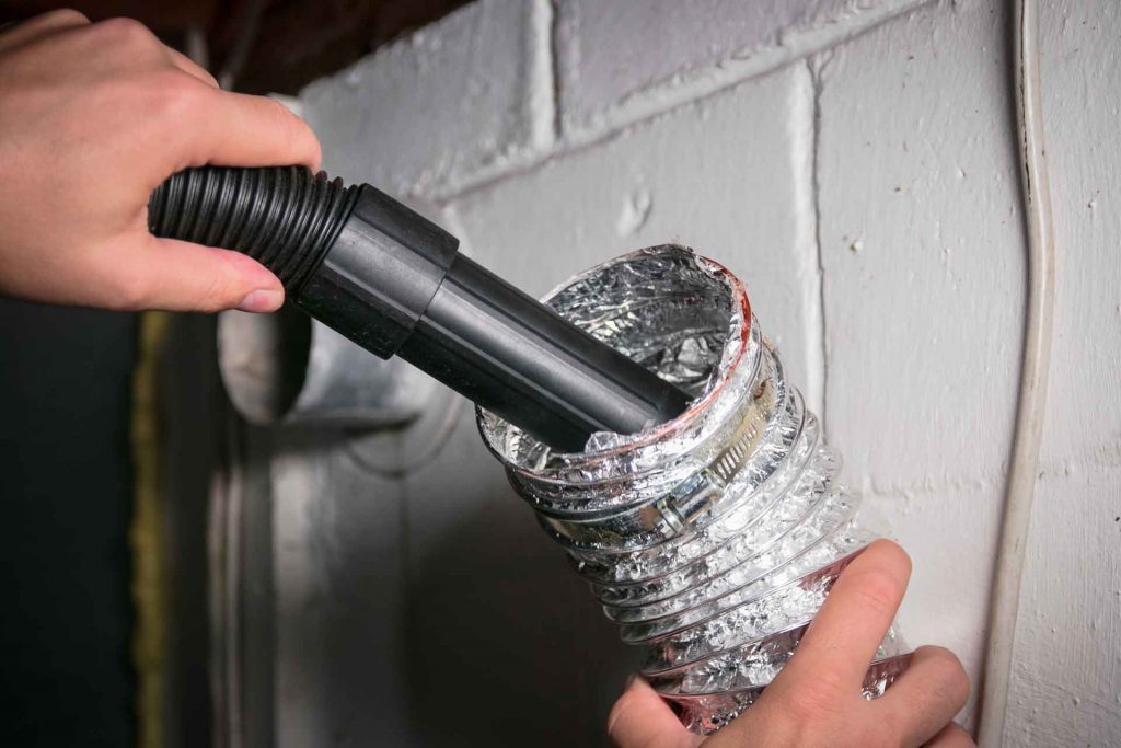 Cleaning a dryer vent with a vacuum cleaner