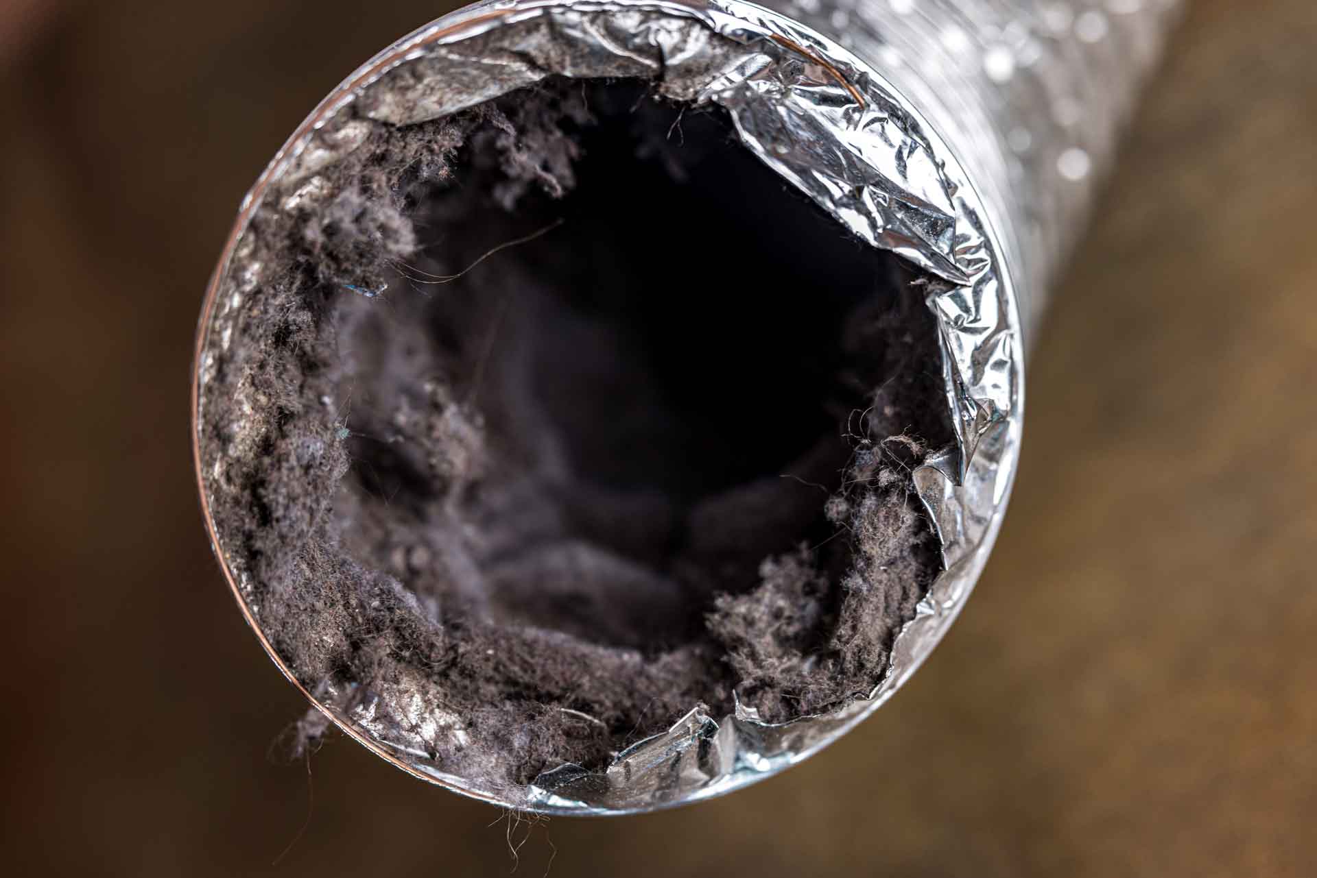 Close-up shot of a dirty dryer vent