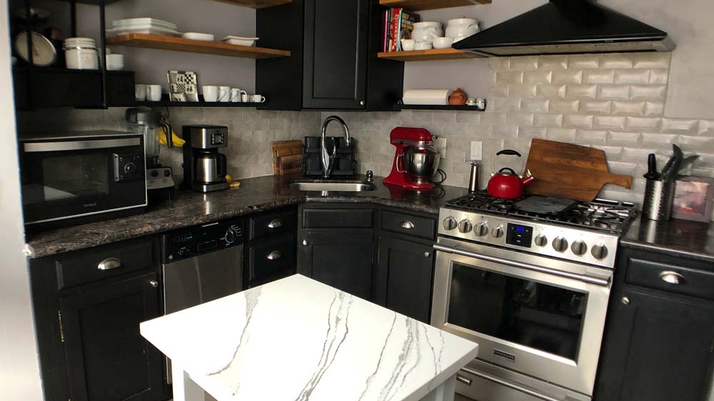 Kitchen with granite countertops and a gas stove